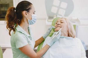 senior woman has dental exam